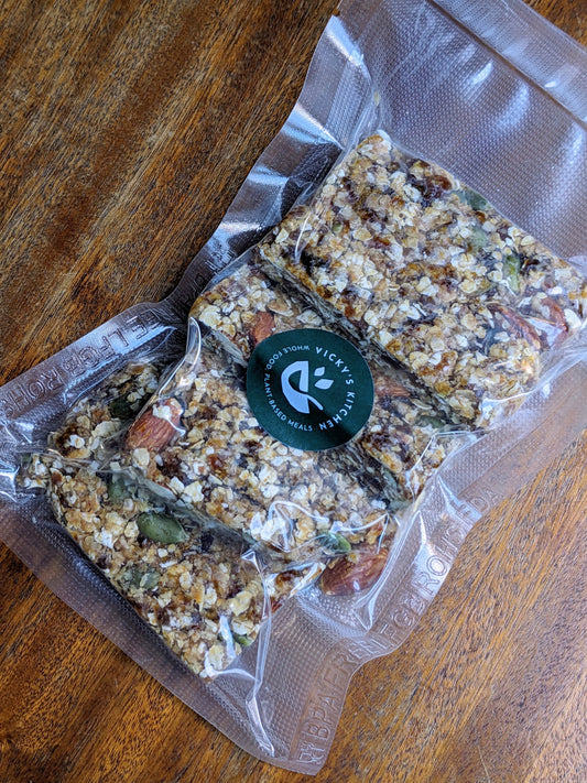 Homemade nutty granola bars made by me, cut into neat portions and ready to eat.