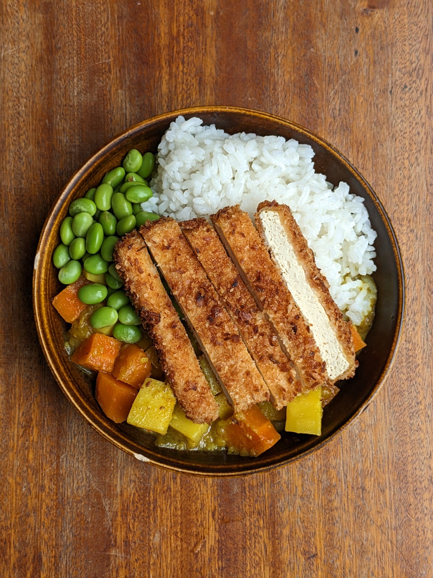 Overhead shot of my tofu katsu curry with crispy tofu and rich curry sauce.